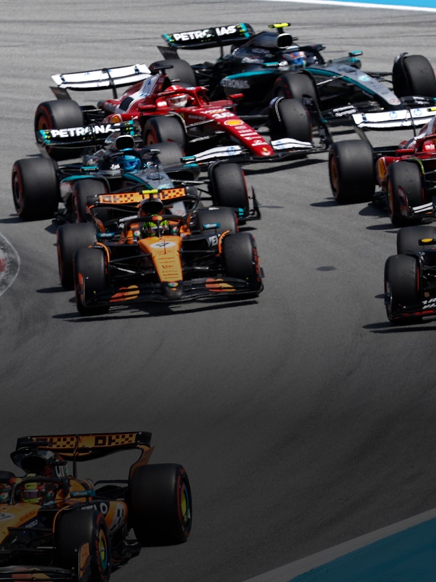 Formula 1 cars racing around Circuit de Barcelona-Catalunya